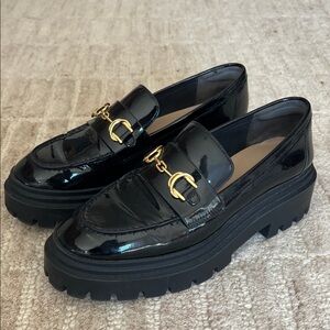Stuart Weitzman Black Patent Loafers with Gold Accents
